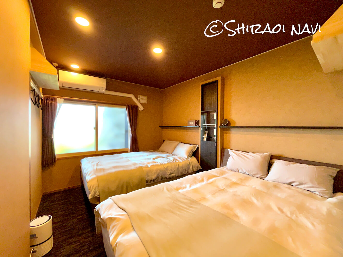 白老の貸別荘『北海道SHIRAOI海眺亭』の寝室イエロー